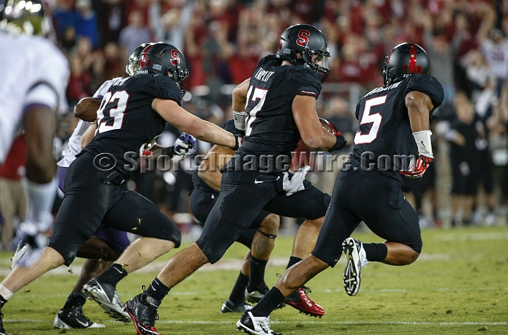 2013Stanford-Wash-011.JPG - Oct. 5, 2013; Stanford, CA, USA; Stanford Cardinal inside linebacker A.J. Tarpley returns an interception 15 yards with 6:11 left in the fourth quarter against the Washington Huskies at  Stanford Stadium. Stanford defeated Washington 31-28.